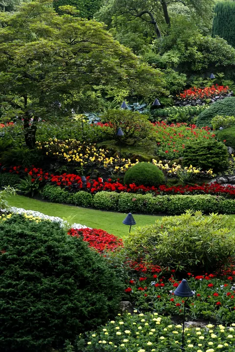 Lush flower beds and trimmed shrubs